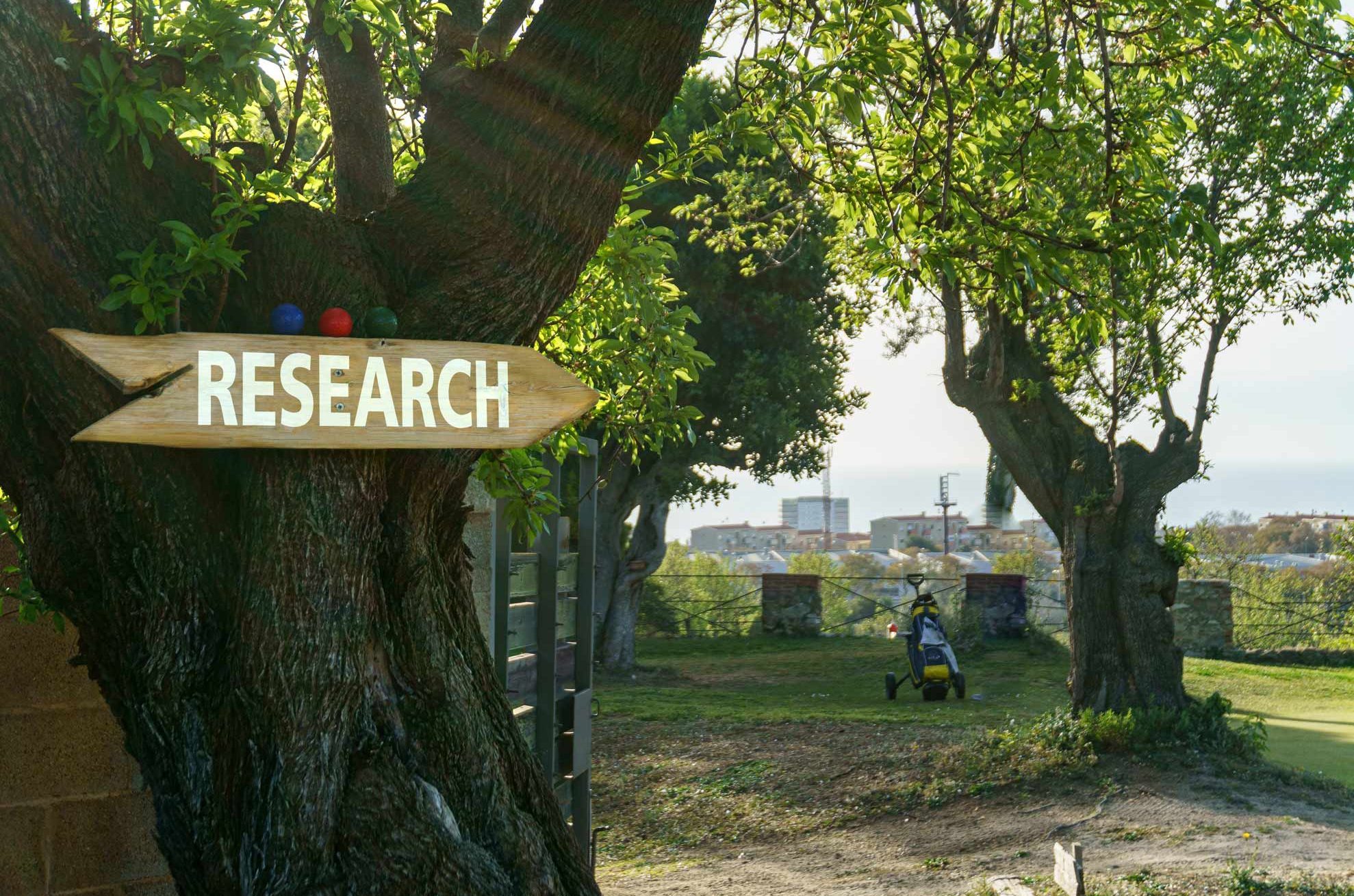 Image of research sign on a tree